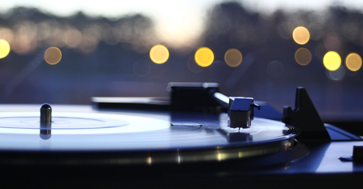 Close-up of a vintage turntable playing a vinyl record with a beautiful bokeh backdrop, capturing a nostalgic mood.